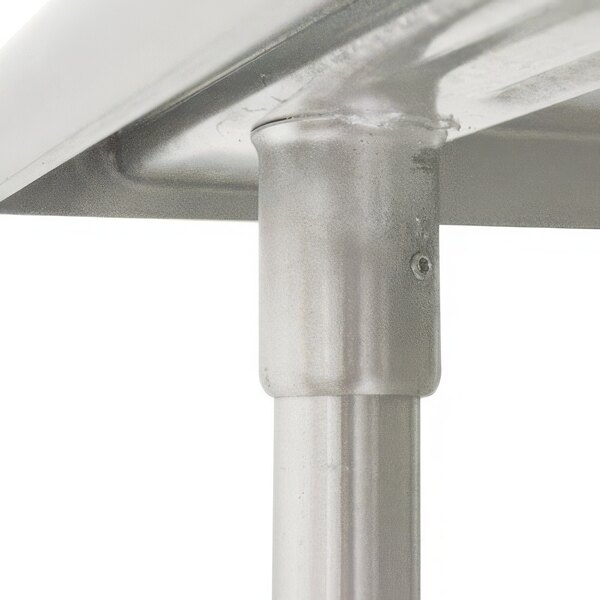 A stainless steel table leg for an Advance Tabco work table.