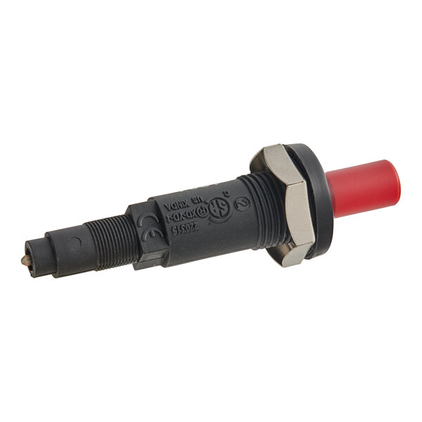 A black cylindrical device with a threaded body, a metal hex nut, and a red push button on one end.