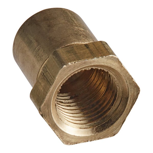 A close-up of a brass threaded nut.