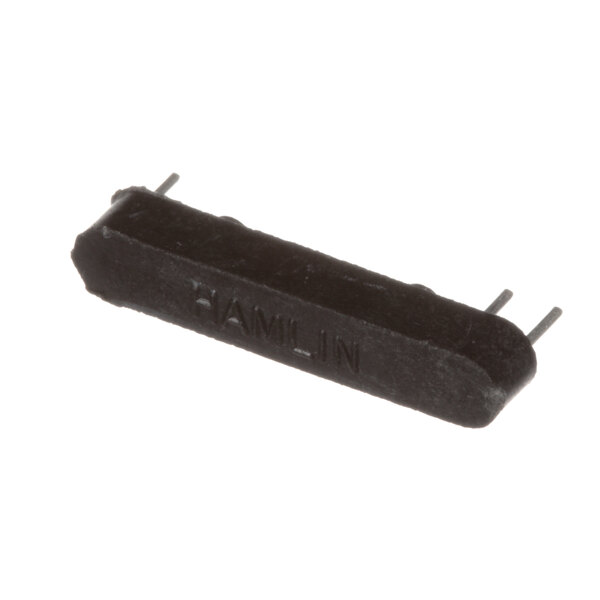 A close-up of a black rectangular Delfield sensor with two pins on a white background.