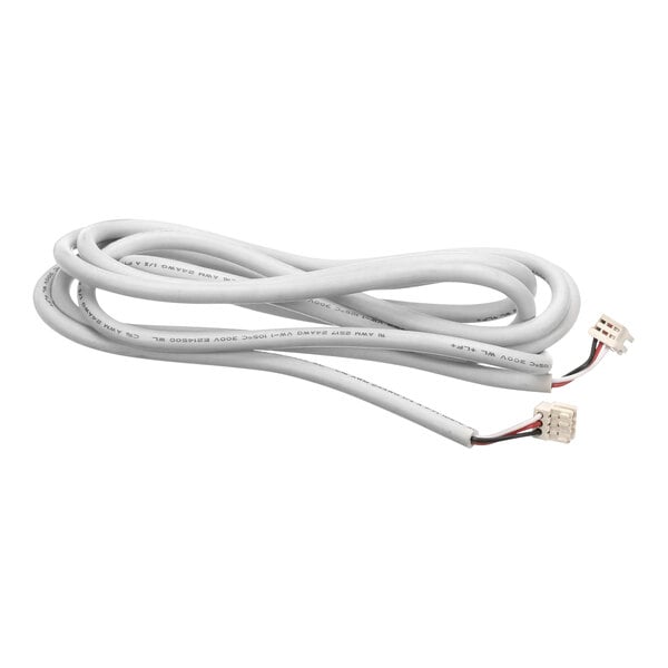 A close-up of a white Delfield cable with a white plug.