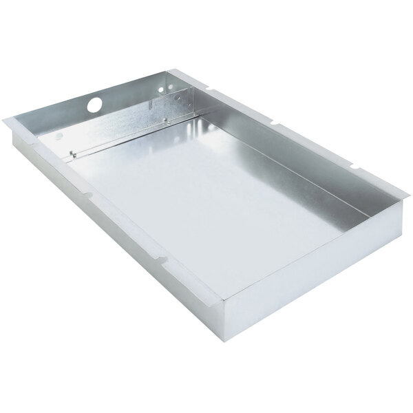 A metal bottom cover with holes for a T/M Wells countertop food warmer.