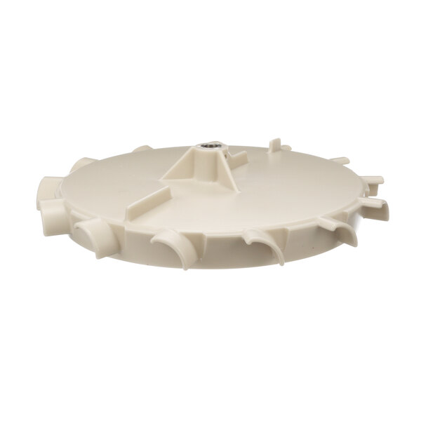 A white plastic circular paddle wheel with holes.