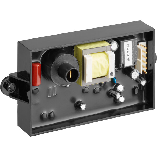 A black Accutemp module with yellow and red electrical components.
