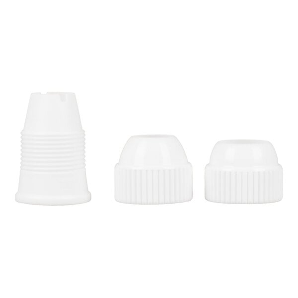 Three white plastic coupler pieces are arranged side by side on a plain background.