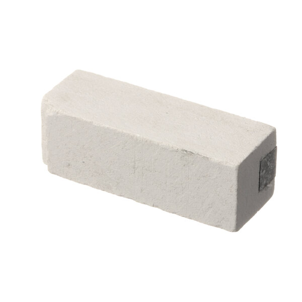 A white rectangular block with a metal strip on a white background.