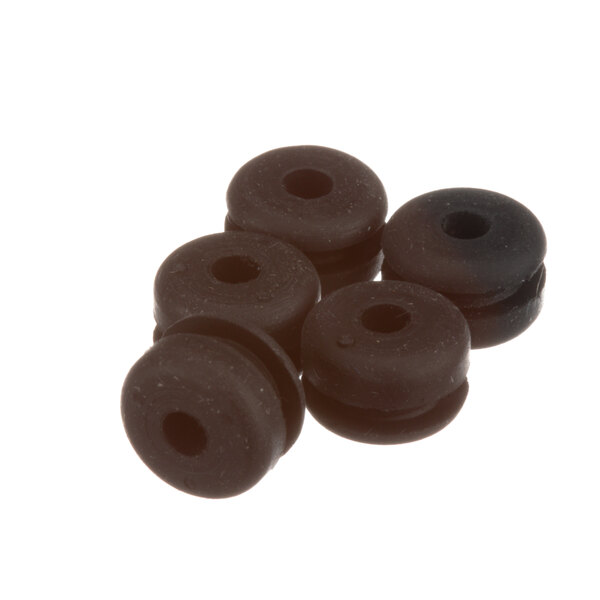 A close-up of a black round grommet with a hole in it.