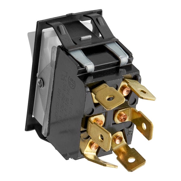 A black and gold electrical switch with two wires.