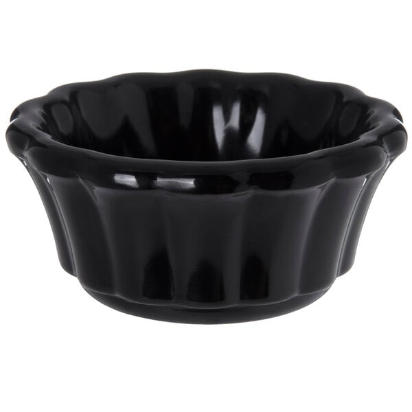 a black bowl with a handle