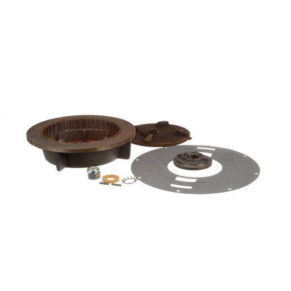 A round metal plate with a hole in the middle.