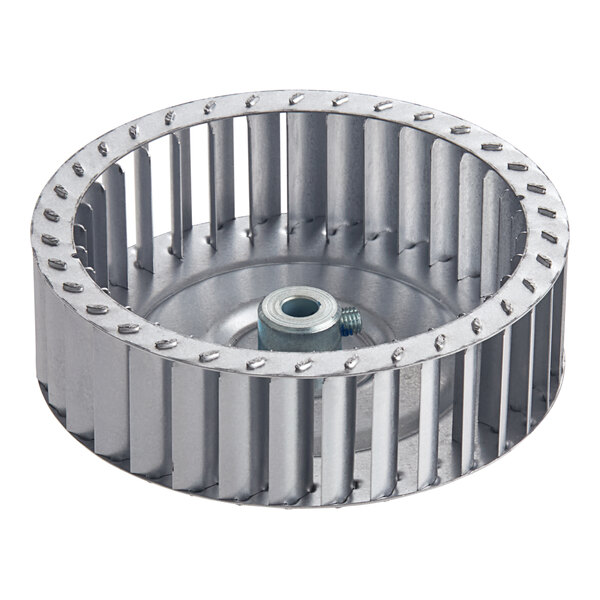 A Vulcan blower wheel, a circular metal object with holes, and a nut.