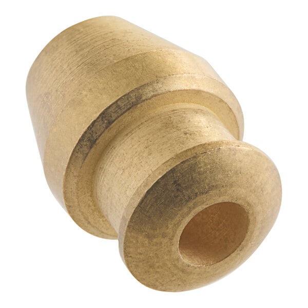 A close-up of a brass US Range ball sleeve with a hole.