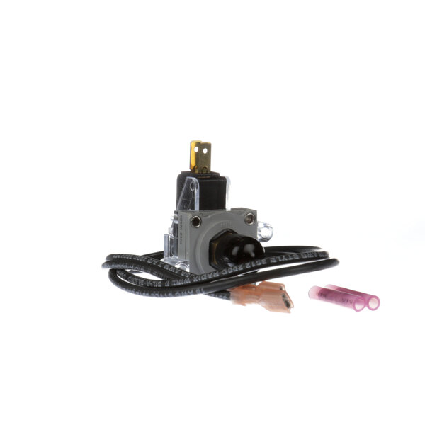A close-up of a Montague pressure switch with wires.