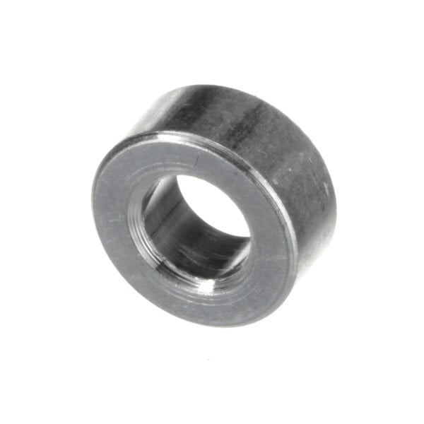 A close-up of a round metal object with a metal ring around it.