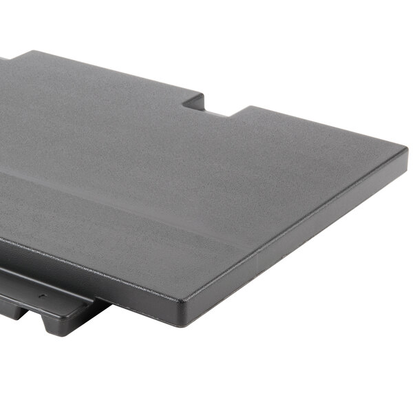 A black plastic Hoshizaki top kit on a table.