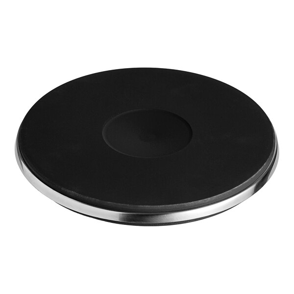 A black Vulcan French E.G.O. plate with a circular hole in it.