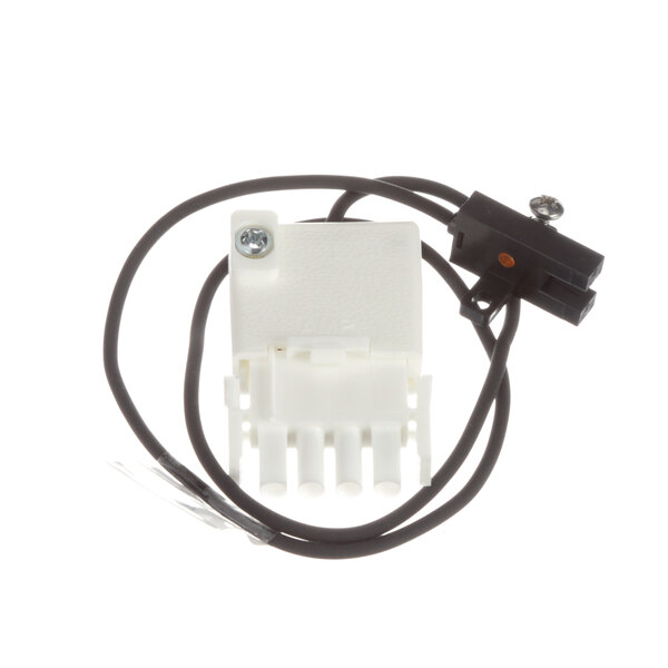 A close-up of a white Follett Corporation optical switch with a white wire harness and connector.