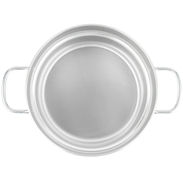 A silver aluminum pot with handles and a white circle.