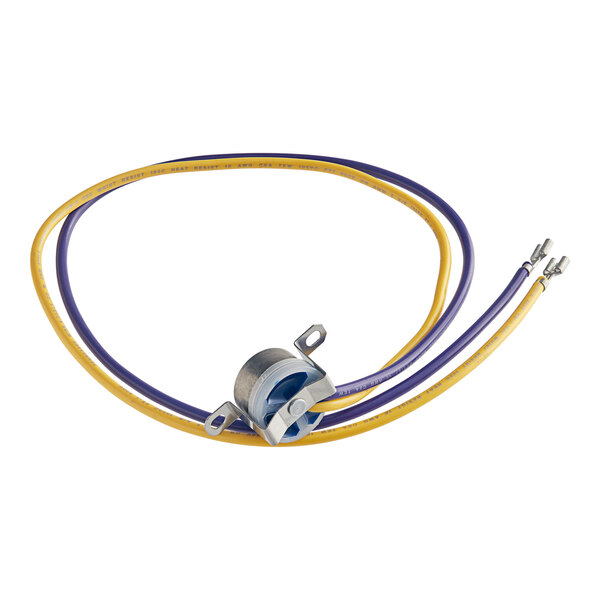 A yellow and purple wire with a small wire connector attached to a Beverage-Air Evap Fan Delay.