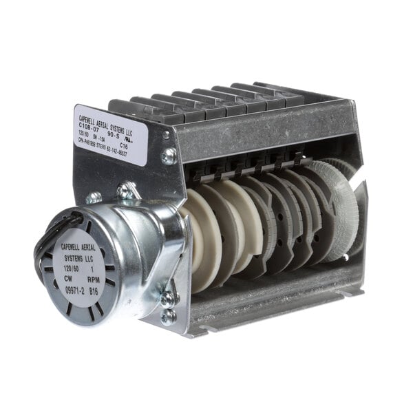 A Stero 7 Cam Timer, a metal device with a round metal object.