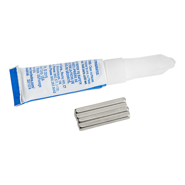 A tube of adhesive gel next to metal rods.