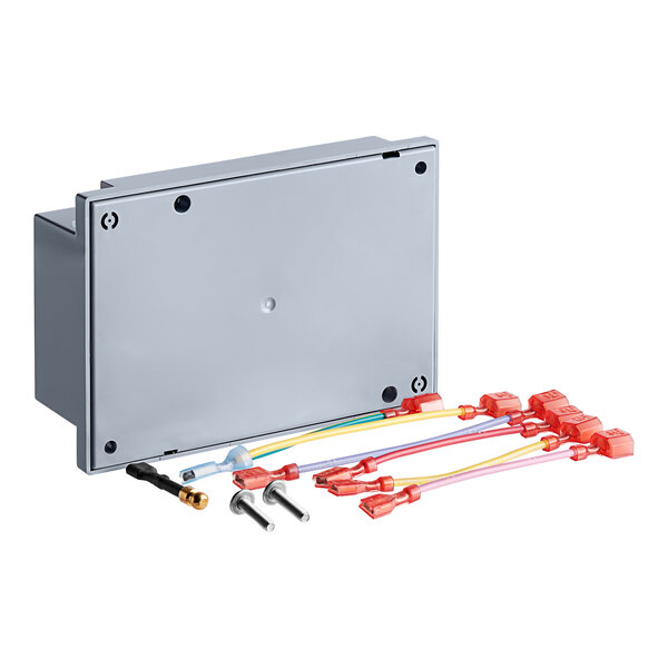 A close-up of a grey Vulcan ignition module with wires and connectors.