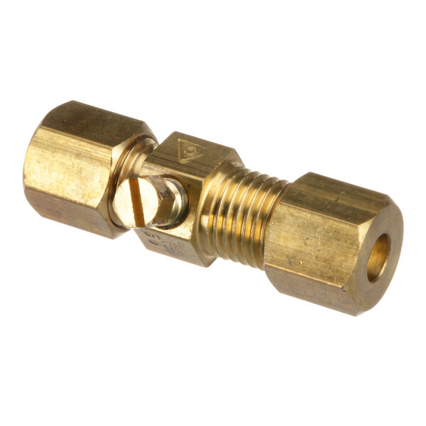 A close-up of a brass nut with a hole in it.
