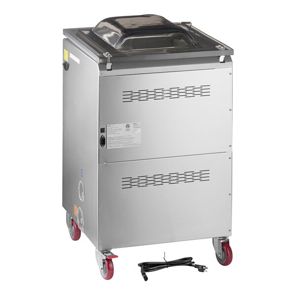 A stainless steel floor model chamber vacuum packaging machine with two seal bars, red caster wheels, and a detachable power cord.