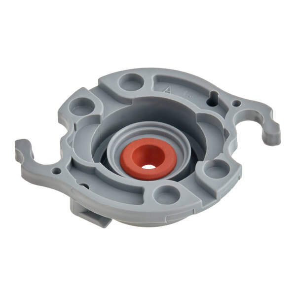 A gray circular plastic component with a red ring in the center, featuring multiple holes and raised sections.