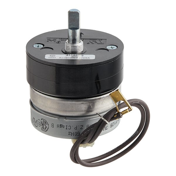 A black and silver circular Vulcan timer with a black cord attached to it.