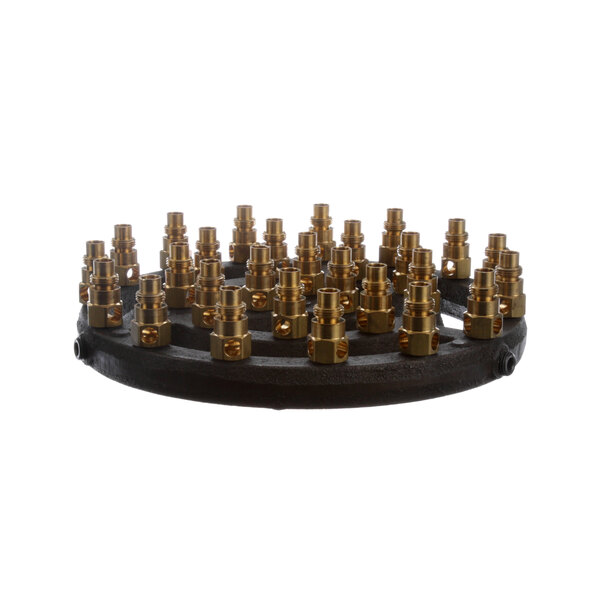 A black circular burner assembly with brass fittings.