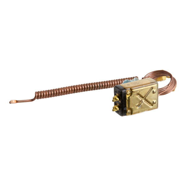 A metallic component with a coiled copper tube attached to a rectangular brass housing featuring electrical terminals.