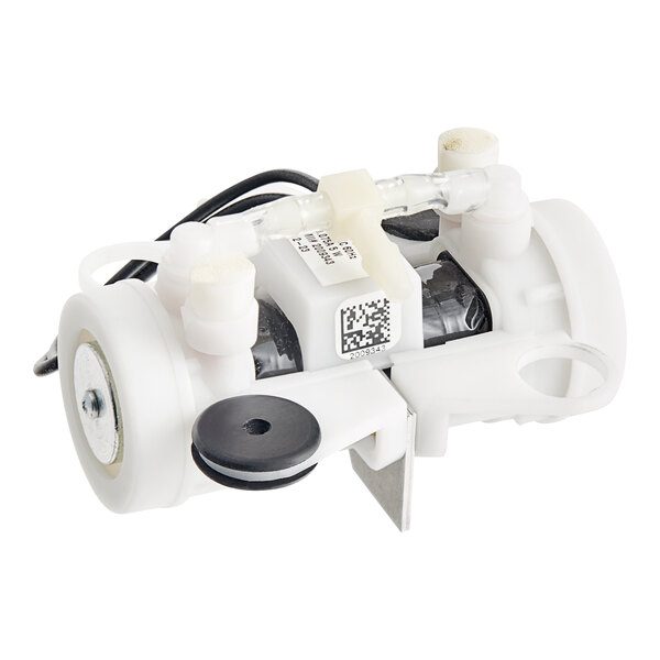 A white Manitowoc Ice compressor with black and white wires.