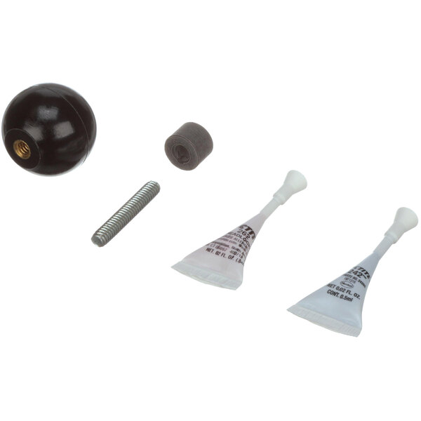 A black knob with white cones on a white tube with black text.