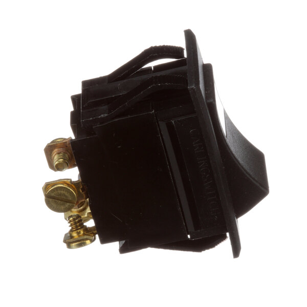 A close-up of a black Dinex rocker switch with gold pins.