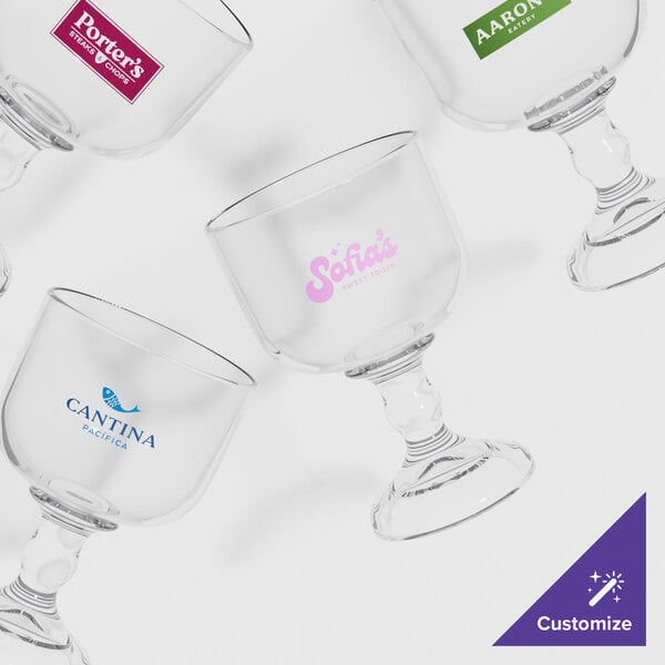 A close-up of a customizable SAN plastic schooner with a pink logo.