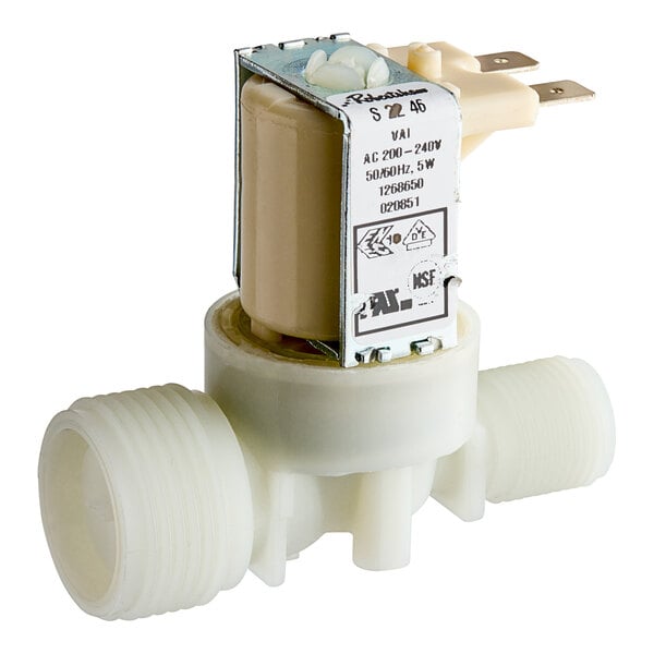 A white plastic Moffat solenoid valve with a plastic plug.