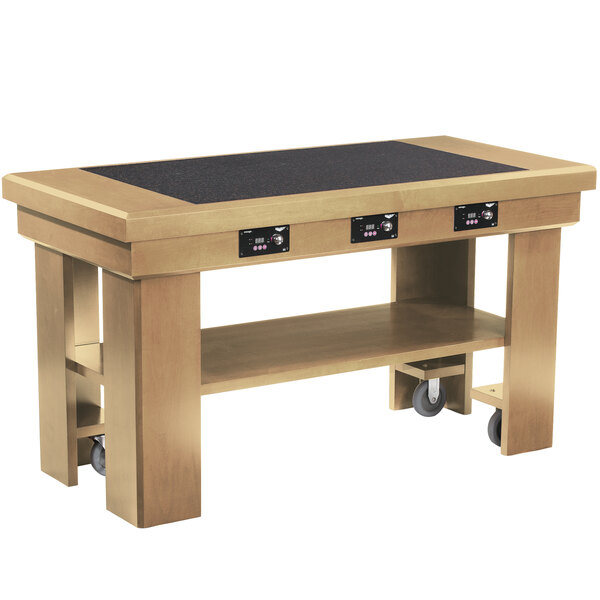 A wooden Vollrath induction buffet table with wheels.