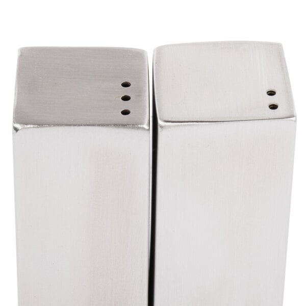 Two Tablecraft stainless steel square salt and pepper shakers.