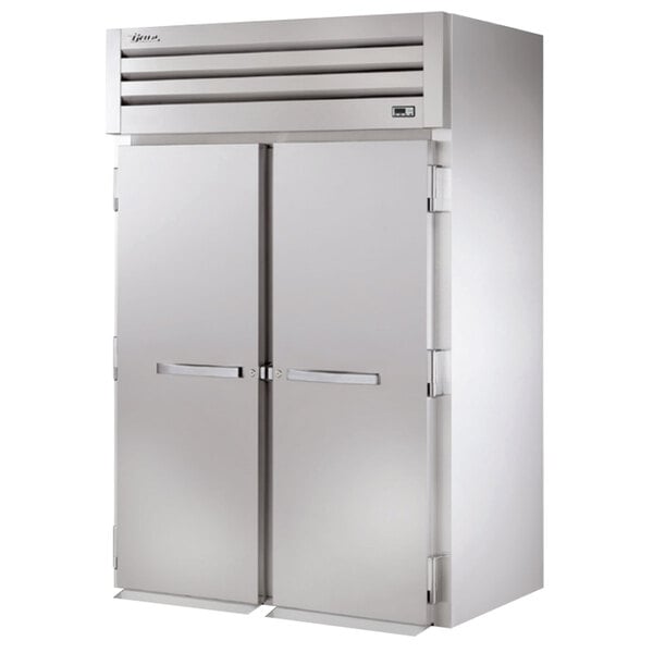 A white True Spec Series roll-in refrigerator with two doors.