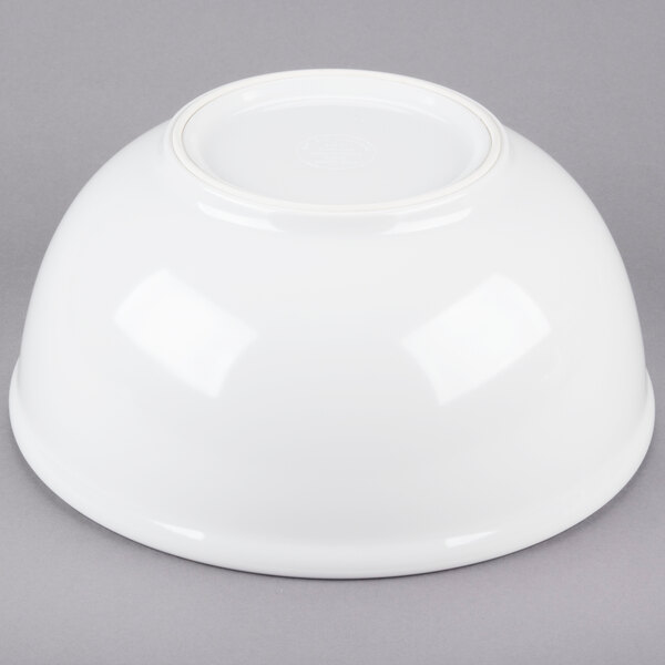 A white Cal-Mil melamine bowl on a gray background.