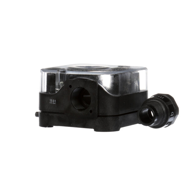 A black plastic box with a clear plastic switch inside.