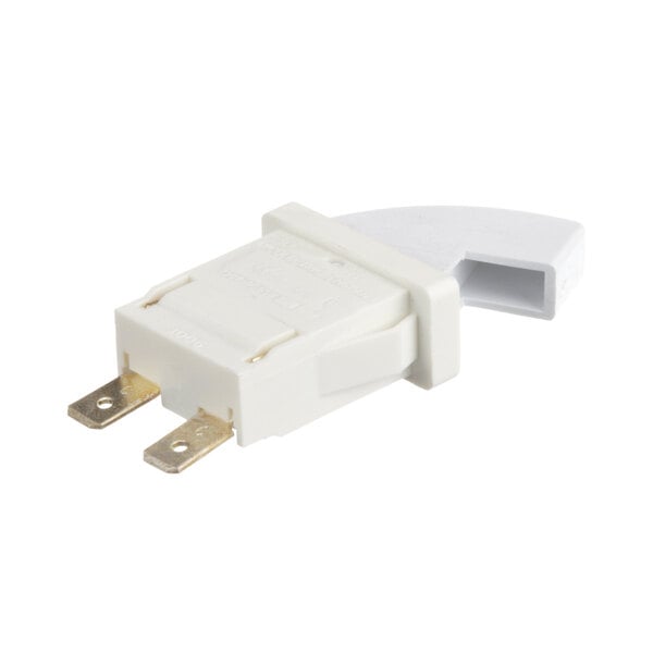 A close-up of a white Randell drawer switch with a yellow plug.
