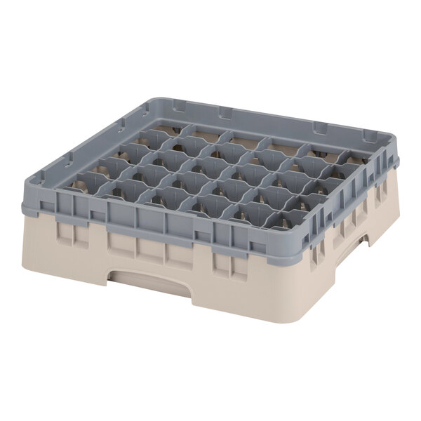 A beige plastic tray with many compartments and holes.