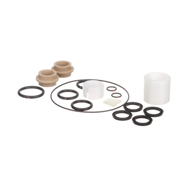 A white plastic cup with a white cylindrical object with rubber seals inside.