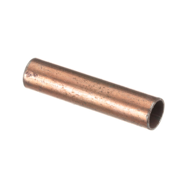 A close-up of a copper pipe with white fittings.