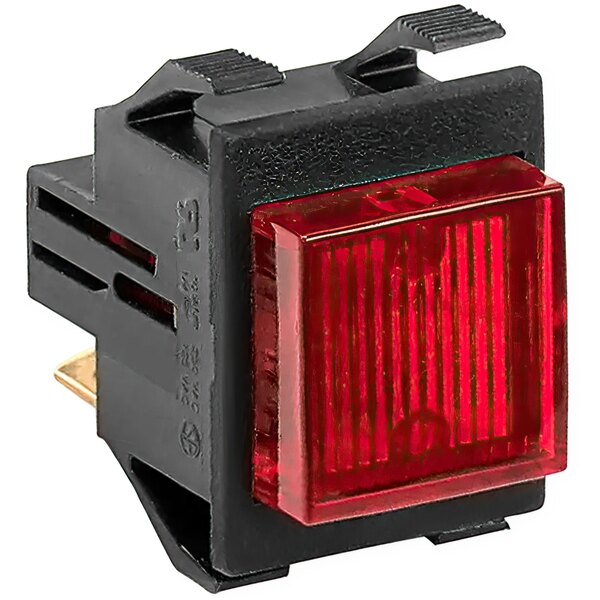 A close-up of a Grindmaster-Cecilware Switch Stop-Java switch with a red light on a black surface.