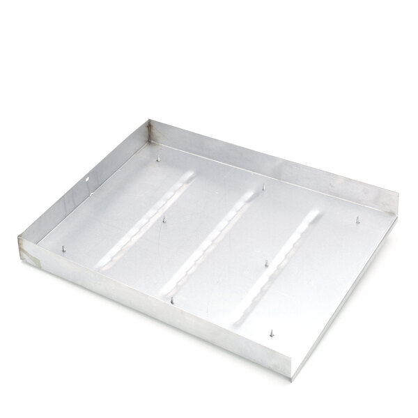 A white metal tray with four holes.