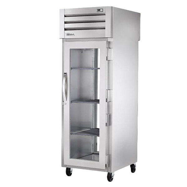 A True stainless steel pass-through refrigerator with glass doors.