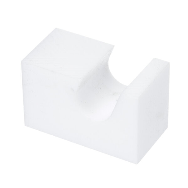 A white plastic Duke conveyor bushing block.